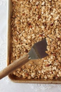 Scooping up the baked granola.