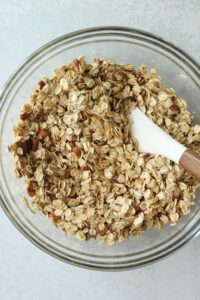 All of the ingredients are in a large clean bowl and are stirred together.