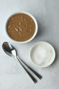 The coconut oil and almond butter are in bowls.