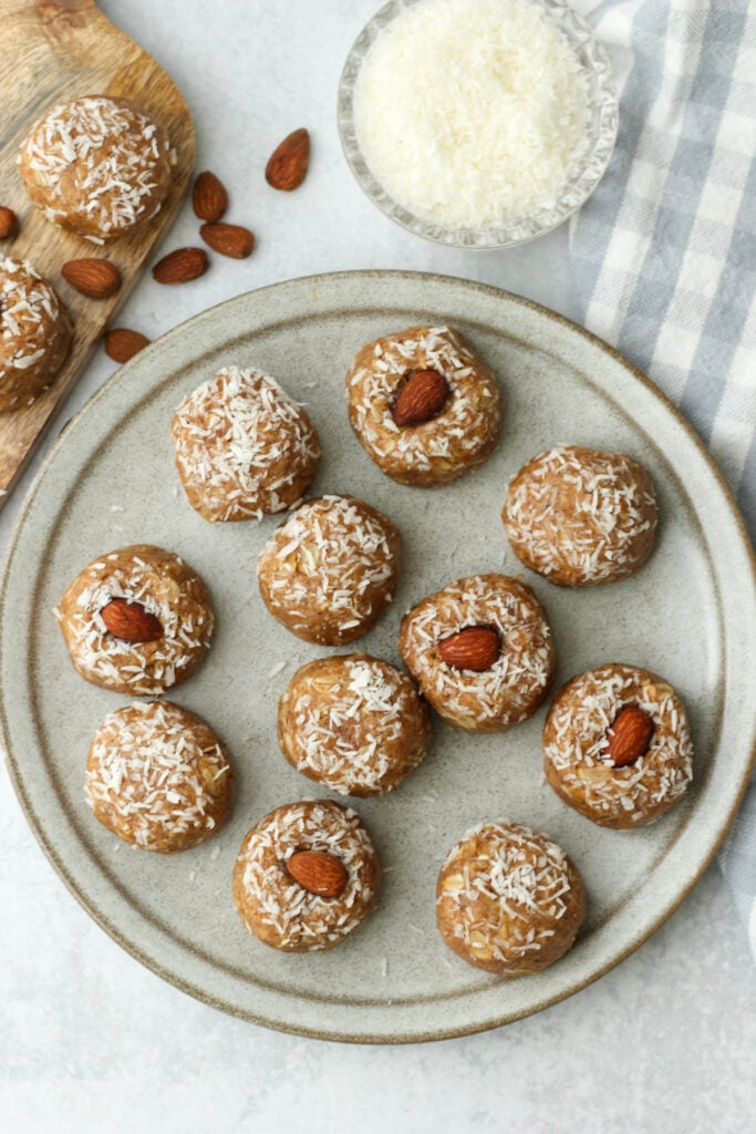 All of the energy balls have been rolled into coconut and are plated.