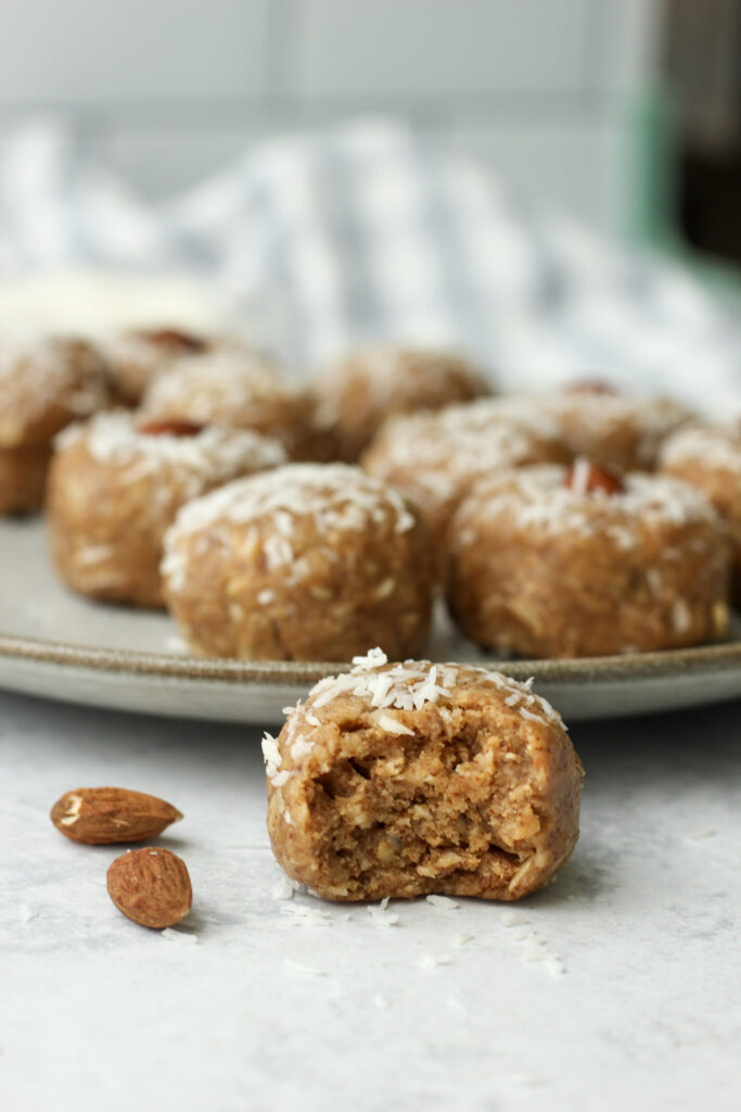 A bite out of a coconut energy ball.