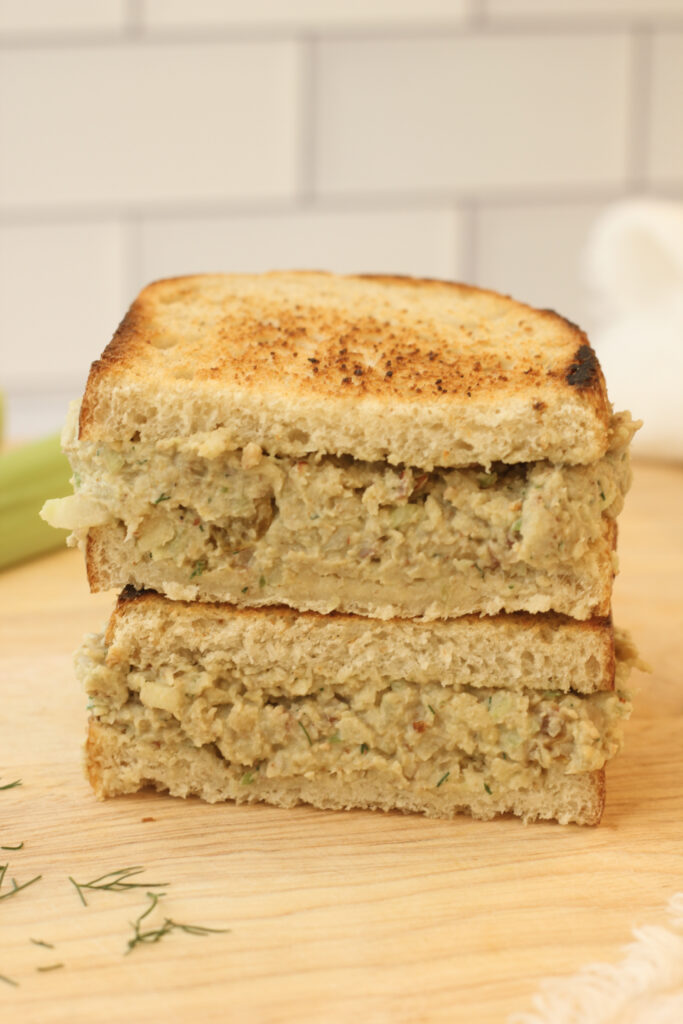 The smashed chickpea mixture has been added to a sandwich.