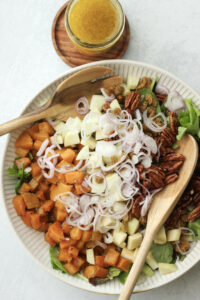 About to toss the dressing into the fall salad.