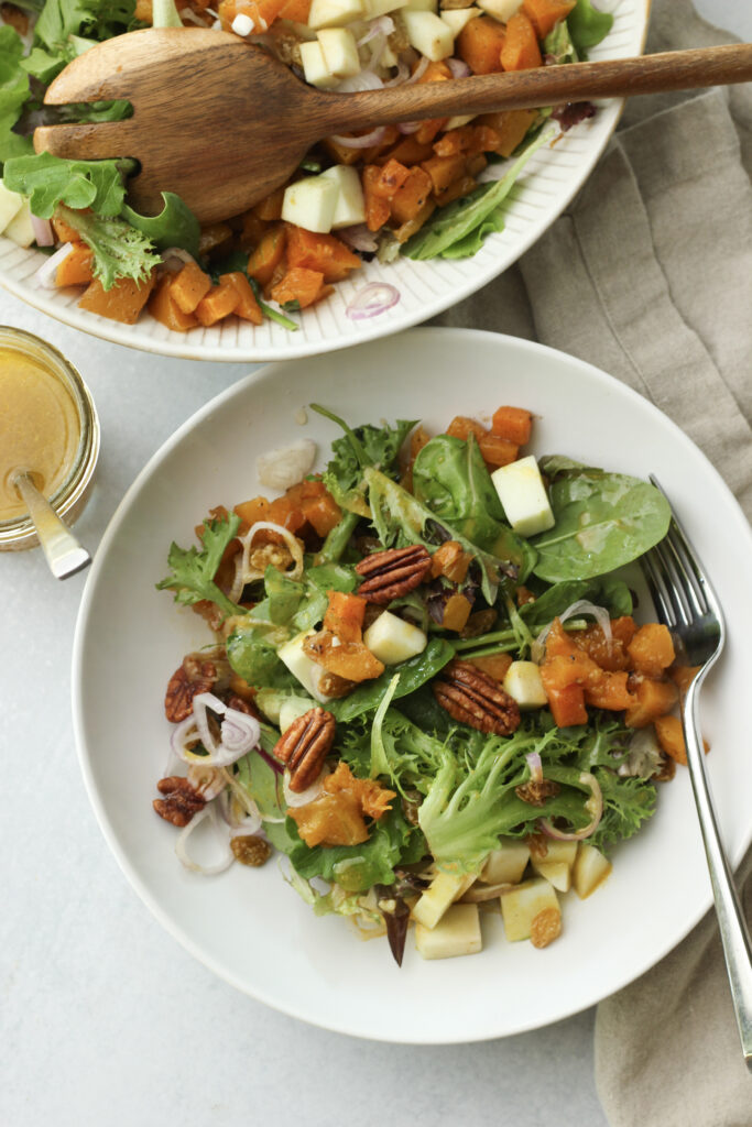 A bowl of salad is ready to eat.