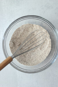 Mixing the dry ingredients in a glass bowl.