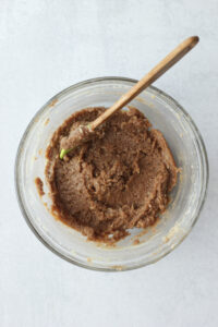 Mixing the wet ingredients in a glass bowl.