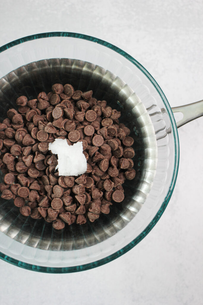 Melting the chocolate and coconut oil in a double droiler. 