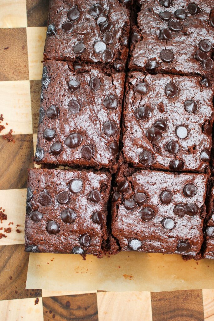 The brownies have just been cut into squares and are ready to eat.