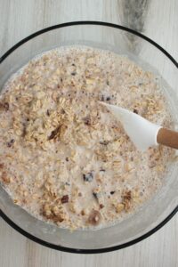 The wet ingredients are poured into the bowl of dry ingredients.