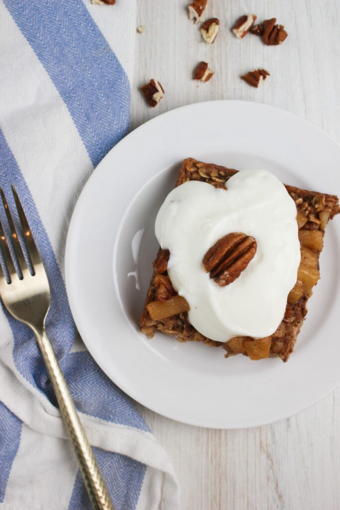 A slice of the baked oatmeal on a plate ready to eat. 