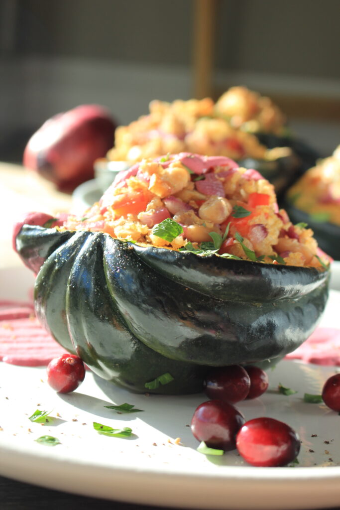 Stuffed Acorn Squash is ready to eat on a plate.