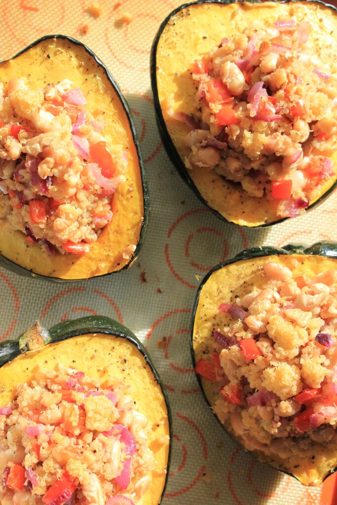 Stuffed Acorn Squash on a cooking tray and about to go into the oven.