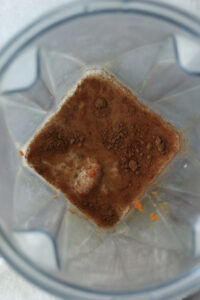 All of the ingredients in a blender ready to be blended.