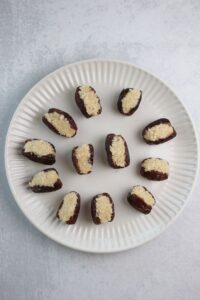 The dates have been stuffed with the coconut mixture.