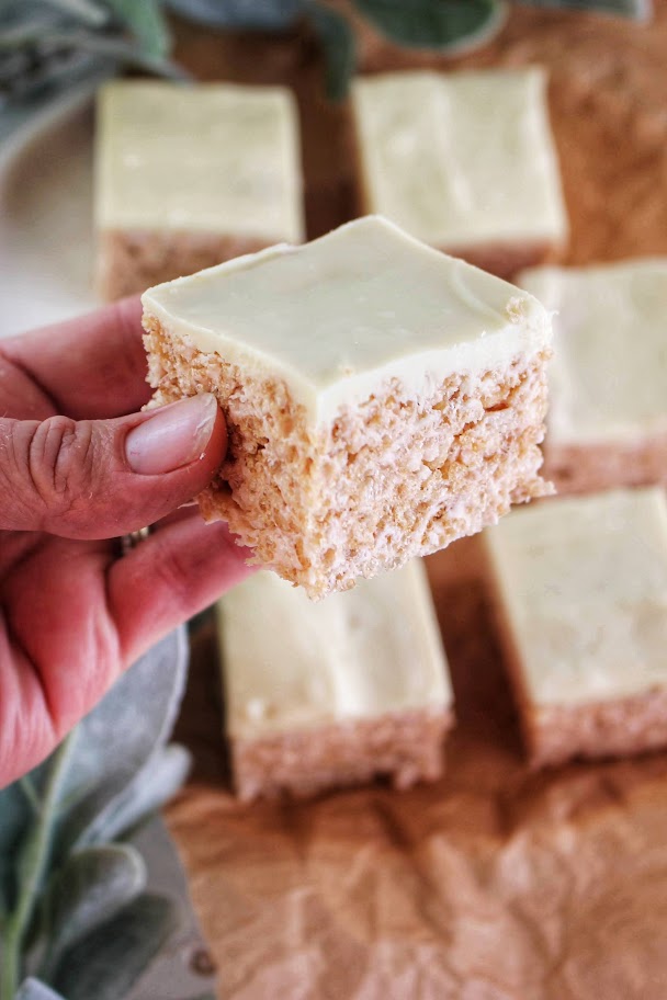 Holding one square of Healthier Peppermint White Chocolate Rice Krispie Treats.