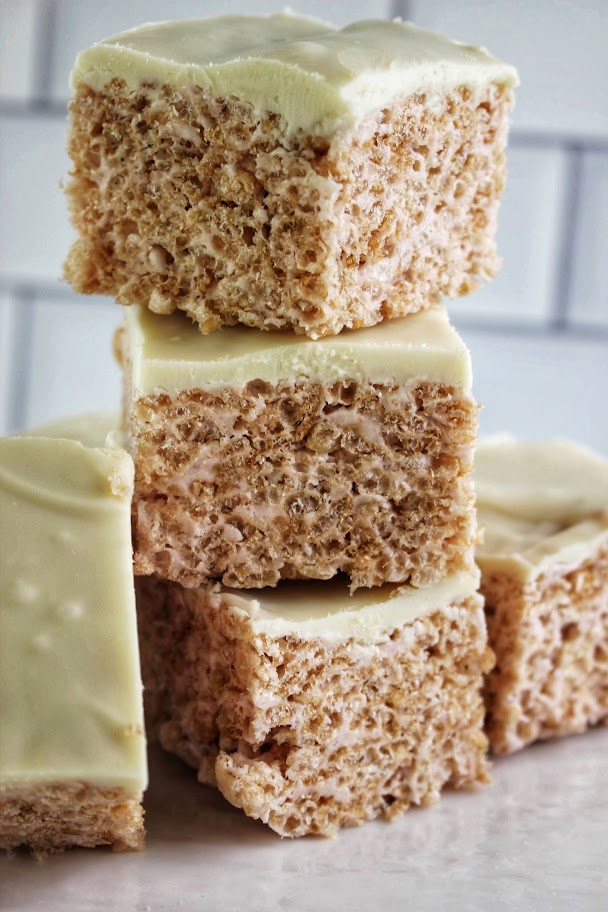 Healthier White Chocolate Peppermint Rice Krispie Treats stacked high.