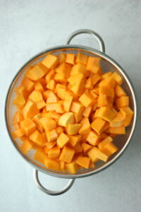 The cubes have been washed off in a colander.