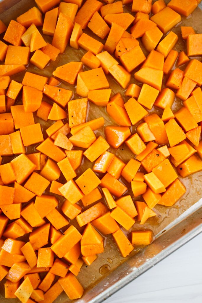 The butternut squash is in a pan and ready to be cooked.