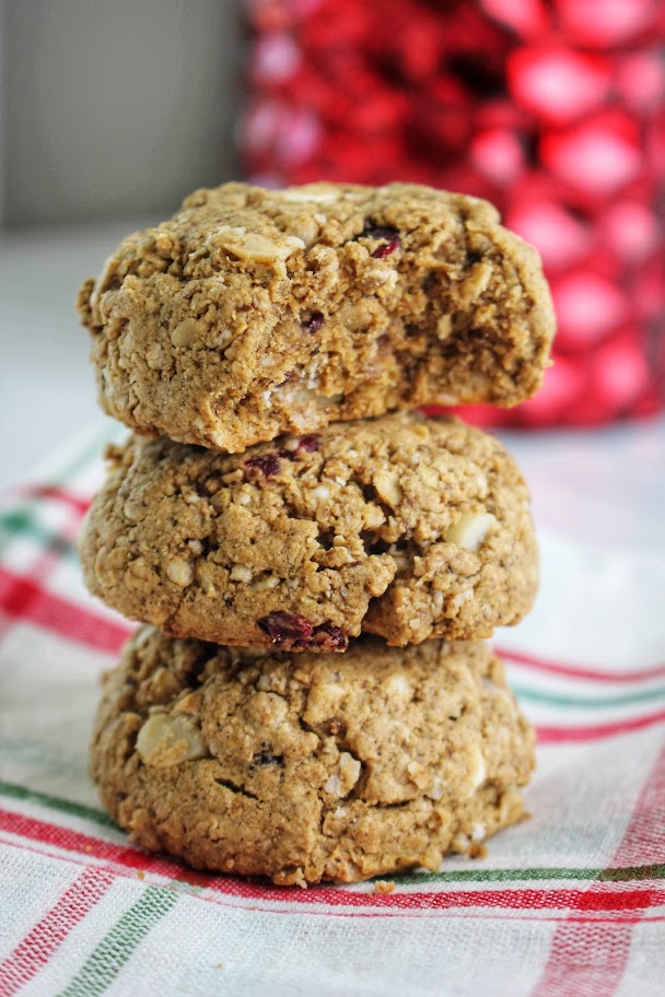 Three white chocolate cranberry cookies stacked.