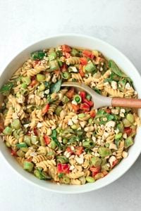 The peanut sauce has been tossed into the salad and it is ready to serve.