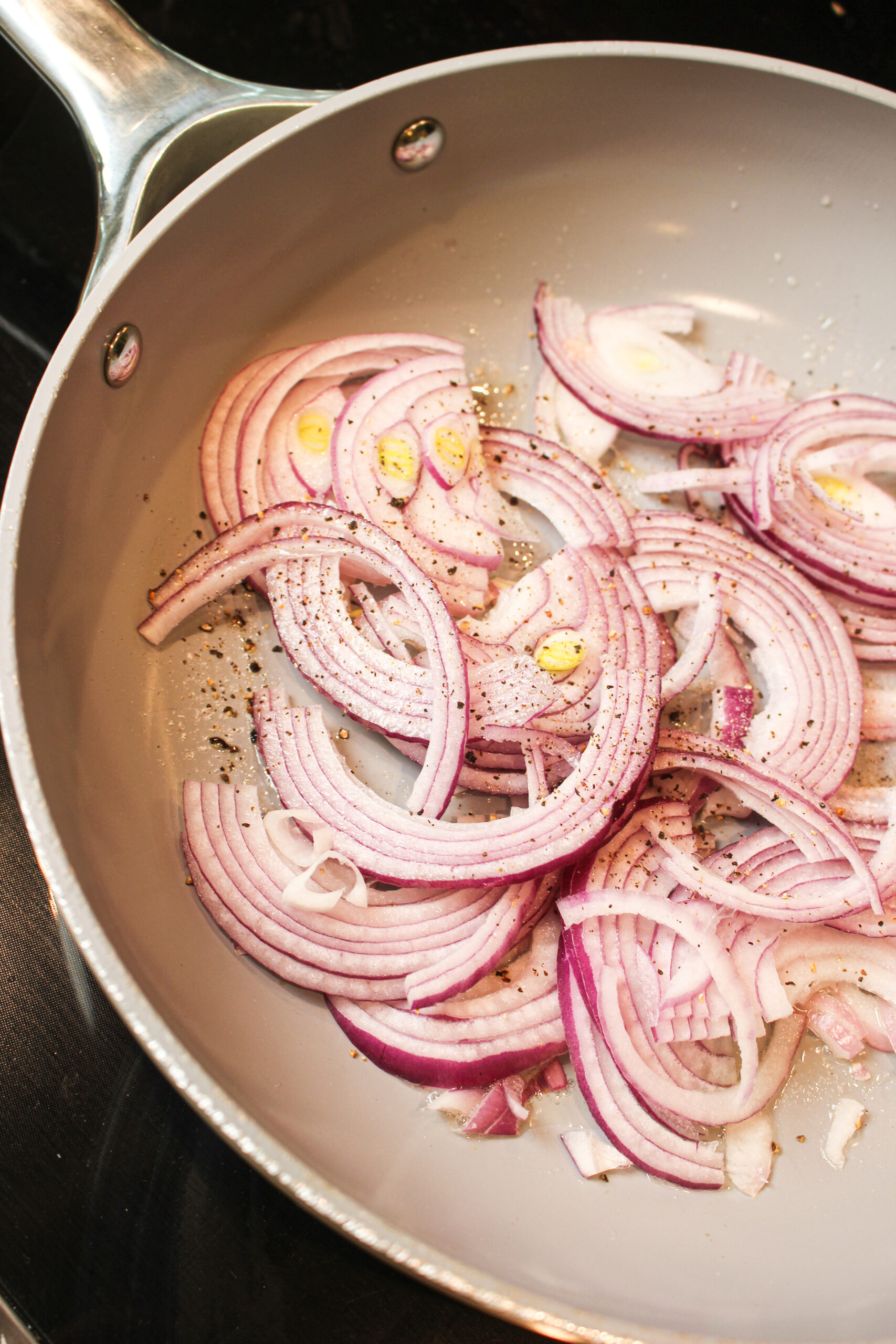 Grilled onions in a pan.