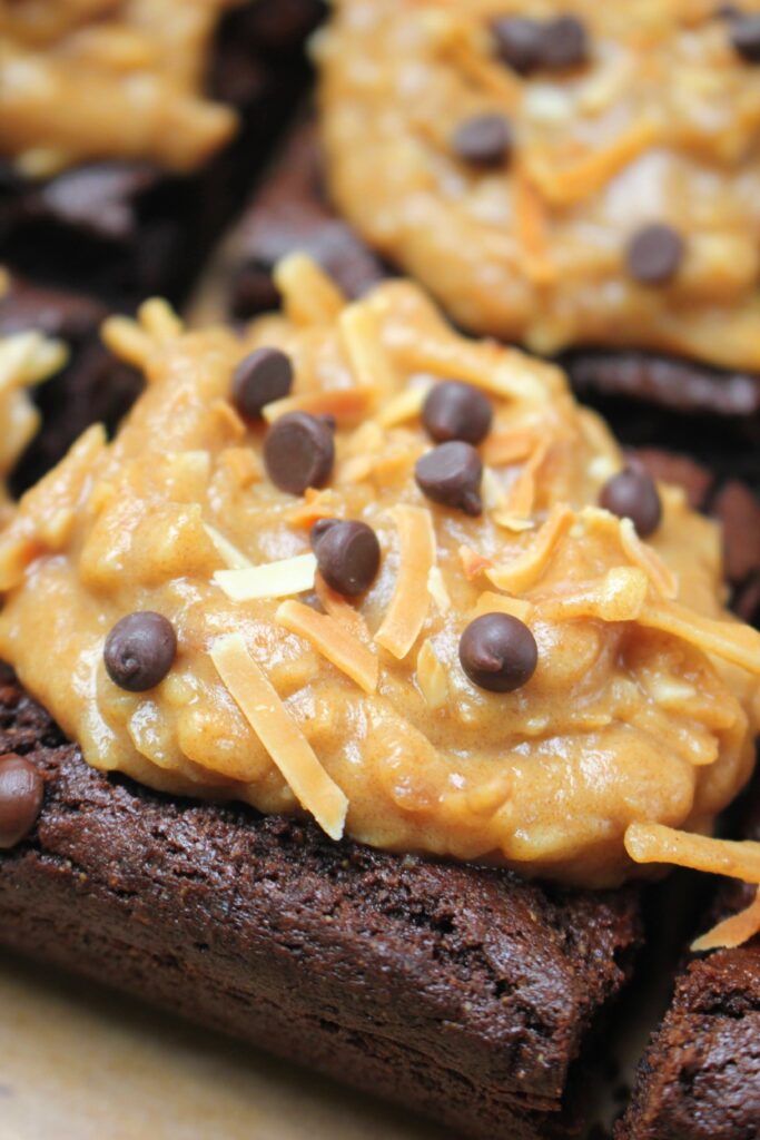 Ready to eat a slice of these vegan brownies with caramel and toasted coconut frosting.