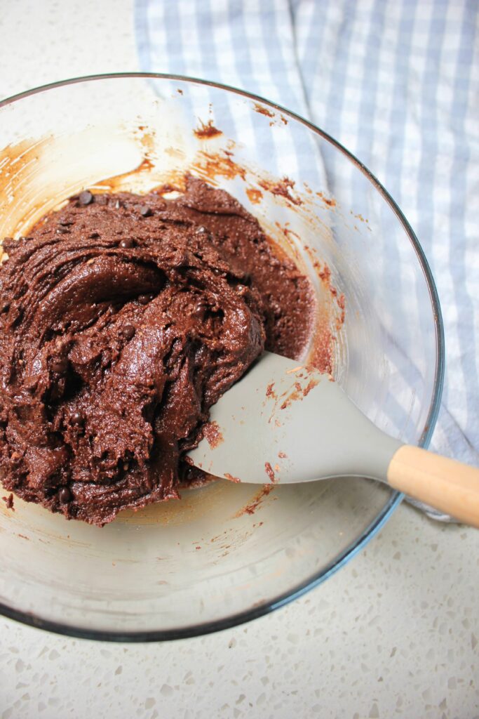 Mixing the brownie batter in a bowl.