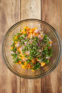 All of the ingredients have been placed into a medium glass bowl.