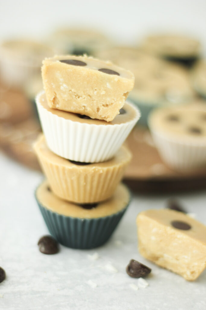 Four fudge cups are stacked on top of each other.