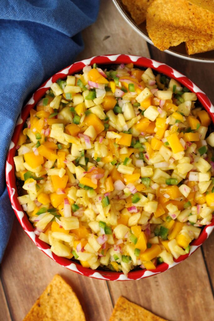 An up-close picture of this salsa in a bowl with tortilla chips.