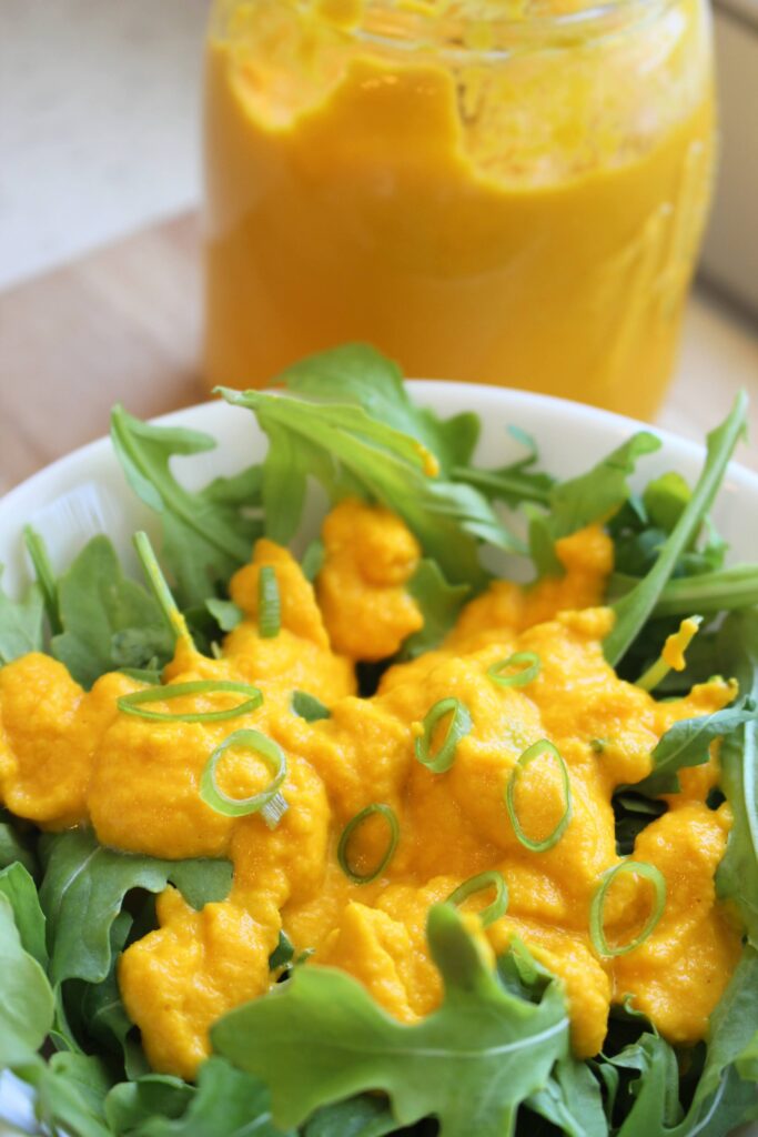 Arugula salad topped with this carrot-ginger dressing.