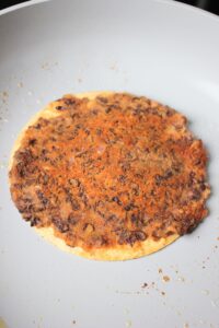 Just flipped the tortilla. The beans are golden brown.