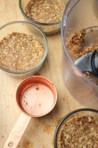 Step one is to press the bottom crust layer into each cup.