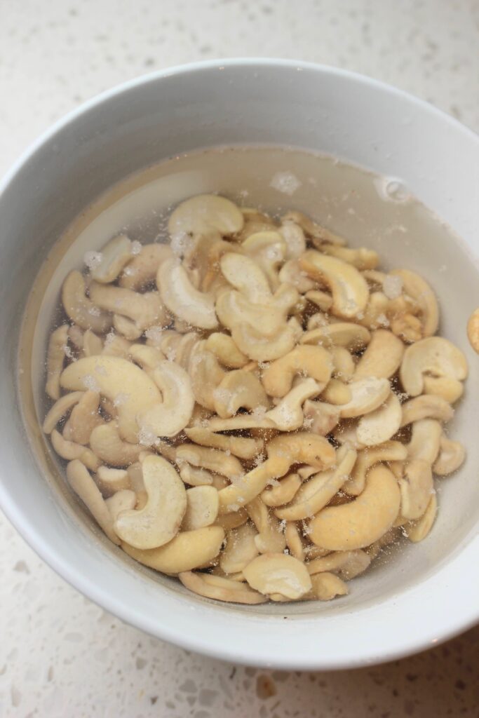 A bowl of soaked cashews.