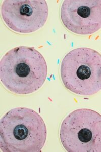 Just finished pressing a fresh blueberry into the tops of each bite.