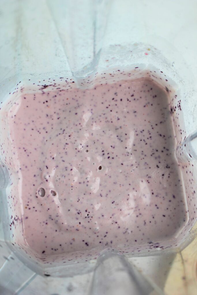 The blended up blueberry mixture in the blender.