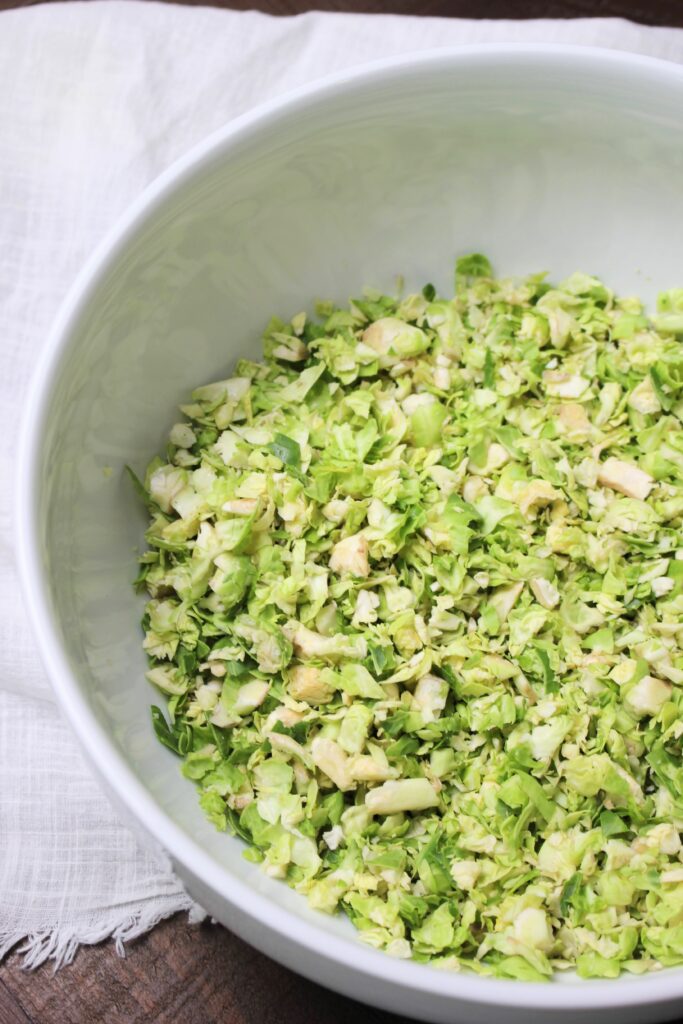 A bowl of shredded brussel sprouts.