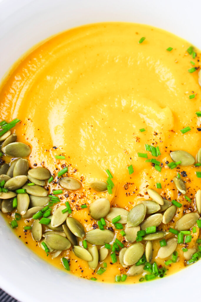 An up close picture of the soup in a white bowl. 