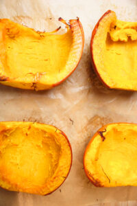 The pumpkin halves are on a sheet pan and just came out of the oven.