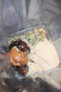 All of the ingredients in the base of a blender.