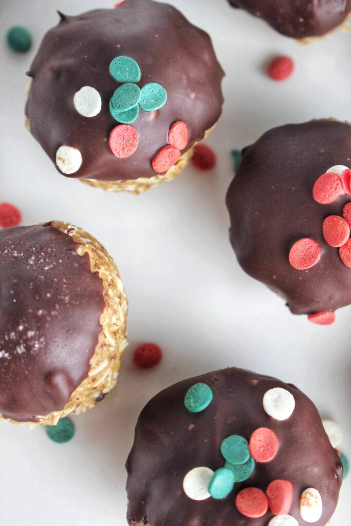 Just added holiday sprinkles of the tops of these peanut butter balls.