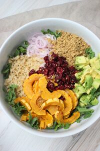 All of the toppings have been added to the salad.