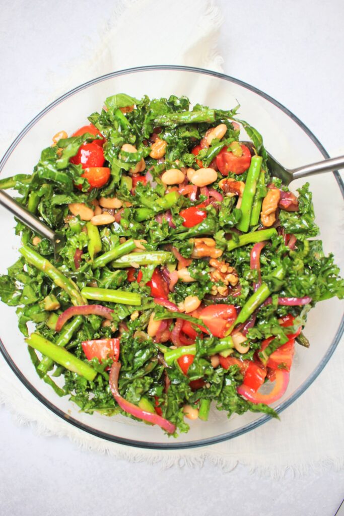 The salad is tossed in the balsamic vinaigrette and is ready to eat.