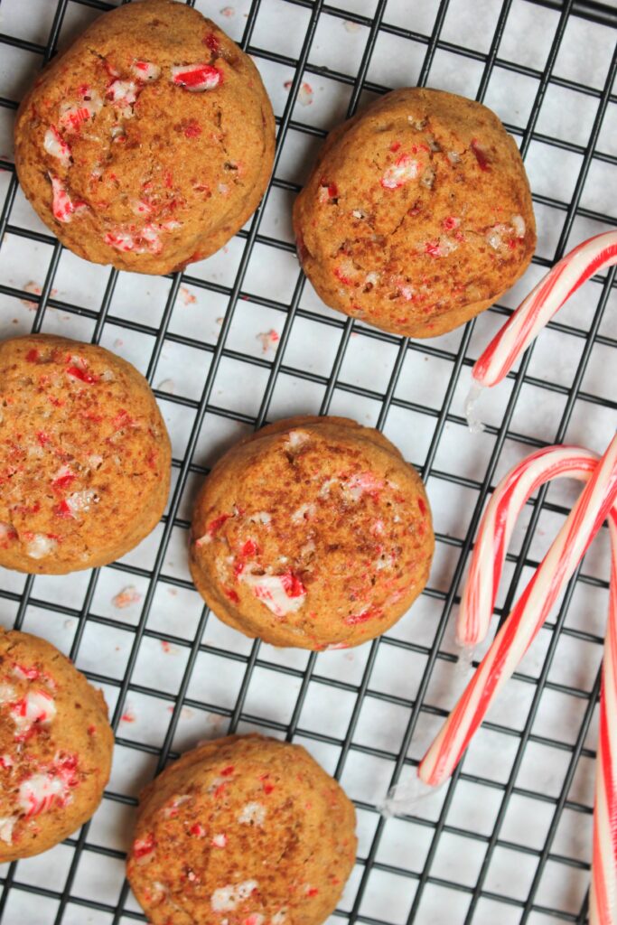 The candy cane cookies are ready to eat on a cooling rack.