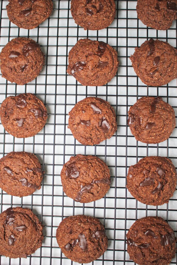 The double chocolate peppermint cookies are cooling on a rack.