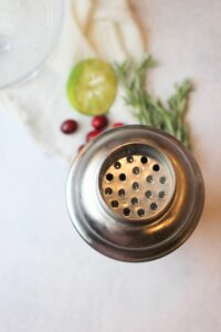 All of the ingredients shaken in a cocktail shaker.