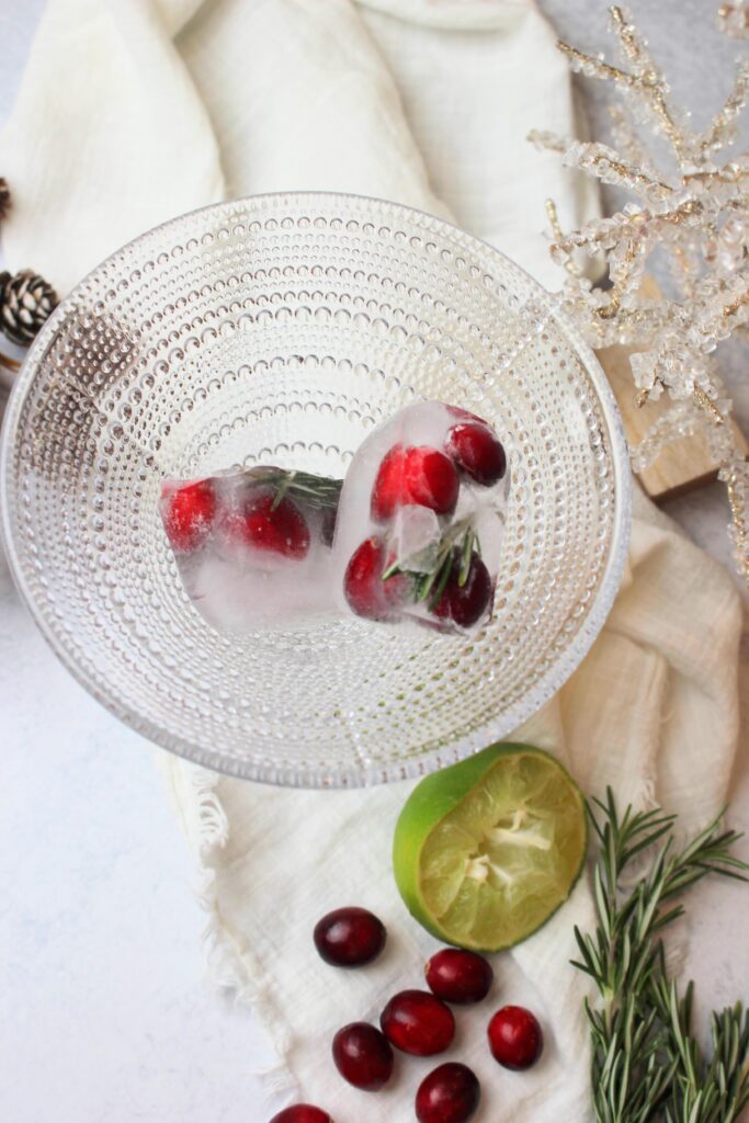Just placed the cranberry and rosemary ice cubes into the martini glass.