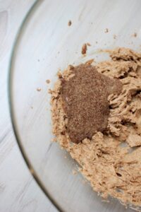 Added the flax egg to the creamed butter and sugar mixture in the bowl.