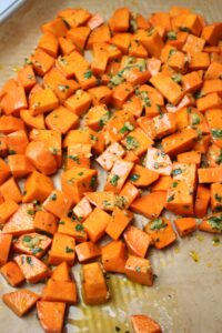 The garlic sauce has been added to the sweet potatoes.
