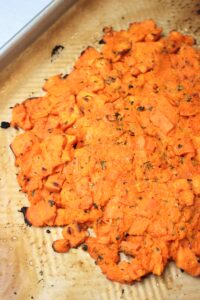 The smashed sweet potatoes have been cooked in the oven.